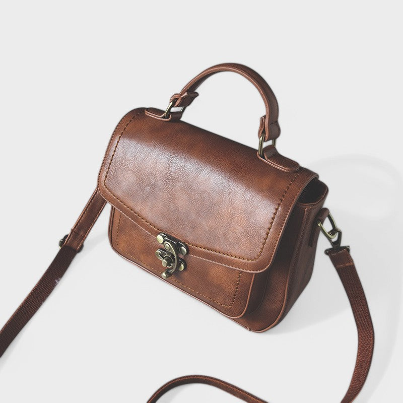 Nora. - Vintage Umhängetasche mit antikem Schloss